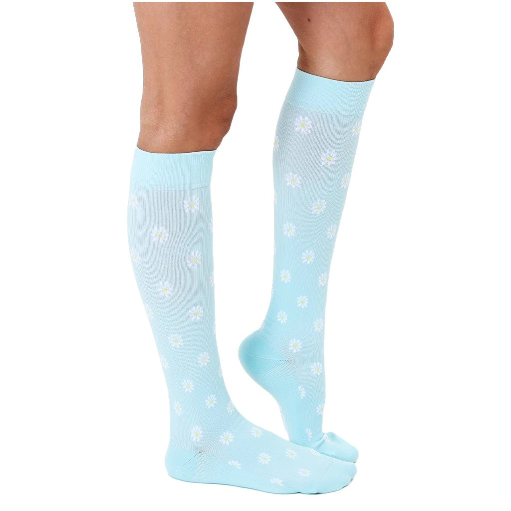 side view of floral compression socks with daisies