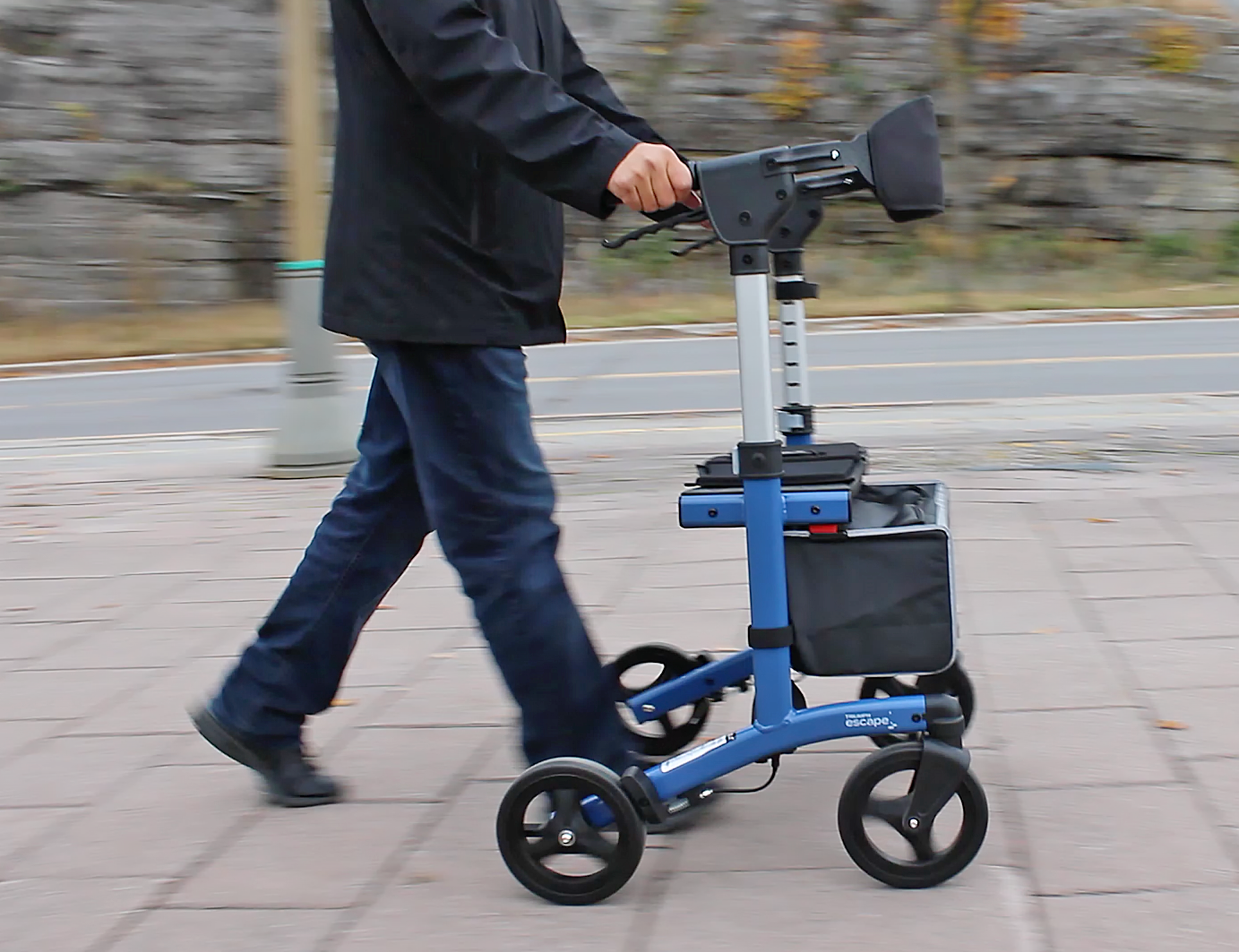 blue escape rollator walker in motion