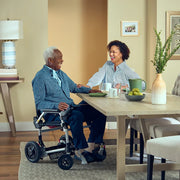 Zoomer Power Mobility Chair at table